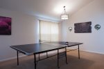 Entry, sitting room, and ping pong table